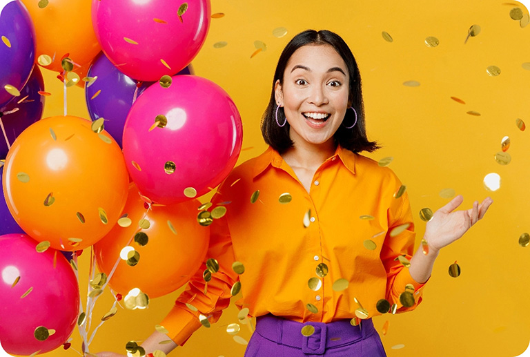 Happy surprised woman holding balloon bouqet