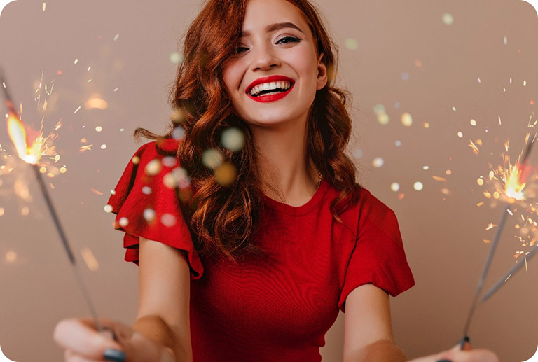 Beautiful woman holding sparklers