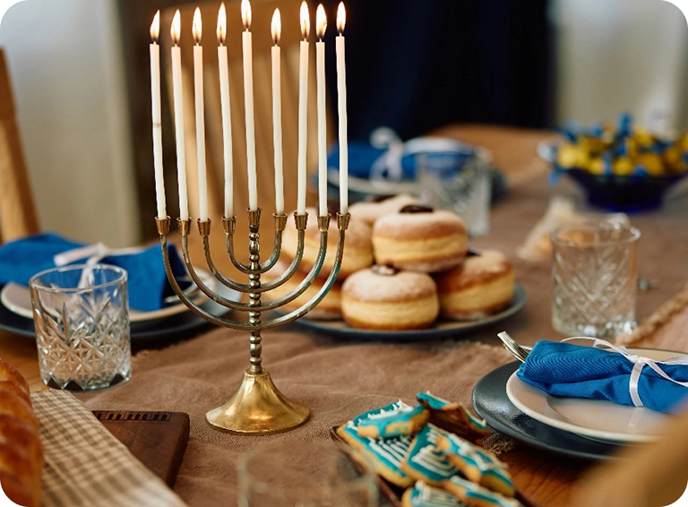 Hanukkah decorations on table with food